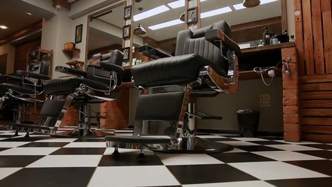 the camera on the Steadicam shows the interior of a Barber shop with a beautiful design.