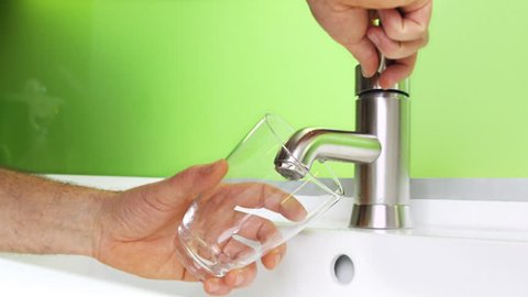 Filling glass of mains water, drinking water