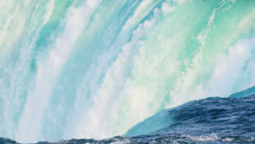 Powerful flowing waterfalls producing clean renewable hydroelectric power | Shutterstock HD Video #3275804
