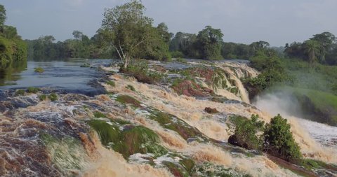 Aerial Waterfalls after vast of turbid water in the equatorial deep forest in Africa Gabon 2015