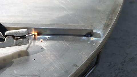 Welder is welding stainless steel
