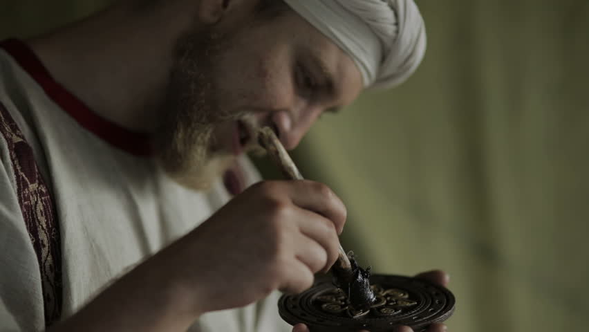 Man paints an artistic mural close up