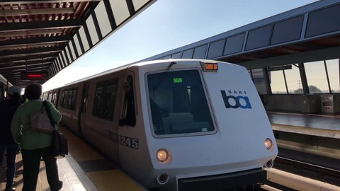 Fruitvale, CA - November 12, 2017: BART train coming into Fruitvale station. Bay Area Rapid Transit (BART) carries commuters to and from San Francisco, the East Bay and San Mateo County.