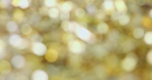 Abstract Christmas background of golden decorations with flares and sparkles