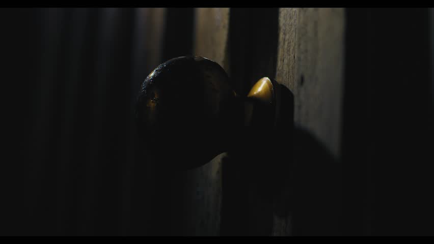 Pushing a door open in a dark, creepy setting. Ghost story, horror, thriller set. Close up on the door knob Royalty-Free Stock Footage #32789527