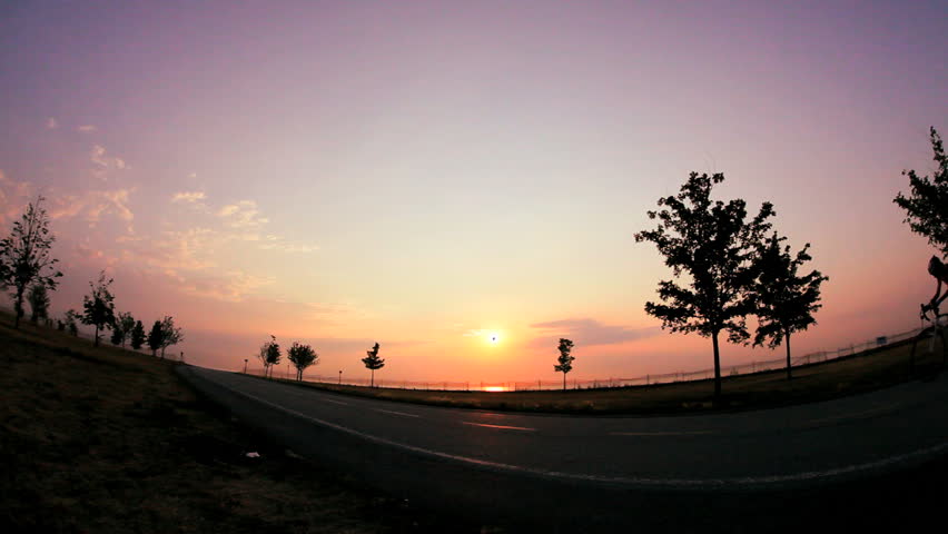 a lone biker on a path at night