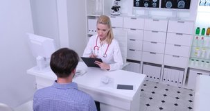 Medical Doctor Woman Take Note on Clipboard Consult Patient Man Cabinet Activity
