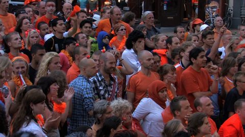 GRONINGEN, HOLLAND - JULY 11: Dutch soccer fans supporting their team during the final of the FIFA World Cup 2010 Netherlands vs. Spain - July 11, 2010 in Groningen, the Netherlands.