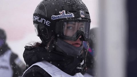 Park City, Utah, February 2017: Close-up of face in slow motion of female mogul competitor at start of F.I.S Freestyle World Cup at Deer Valley Resort.
 Editorial Stock Video