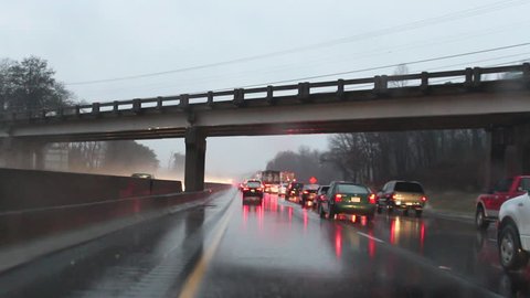 Dangerous rainy driving along an interstate caused by winter storm