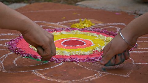 Making of Rangoli during Diwali festival Circa October 2017
