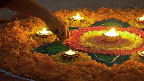 Making of Rangoli during Diwali festival Circa October 2017