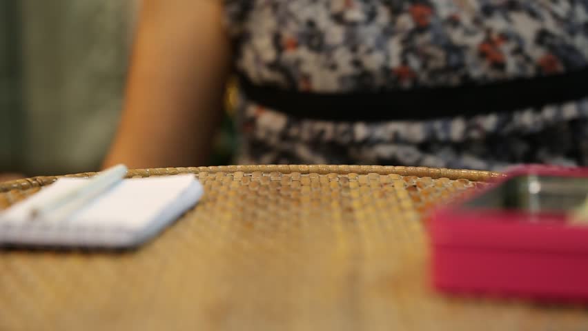 Woman hand counting money closeup on table blur background