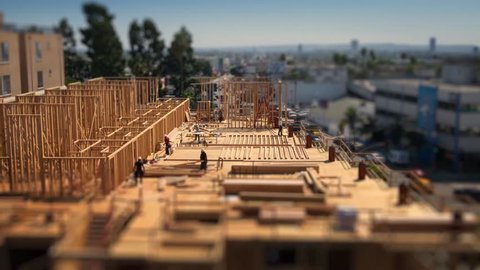 Workers building construction site Los Angeles Tilt shift miniature timelapse, 4K UHD