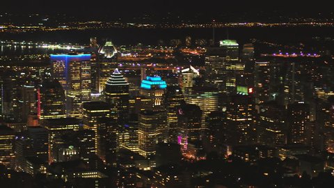 Montreal Quebec Aerial v112 Flying low over downtown at night panning with cityscape views