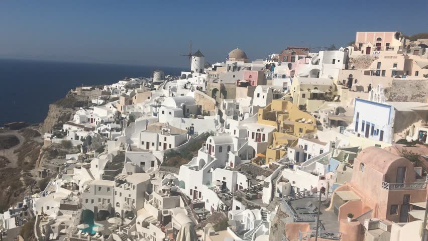 4k video. amazing romantic white houses in Oia, Santorini island, Greece. with a panoramic view of the whole cliff