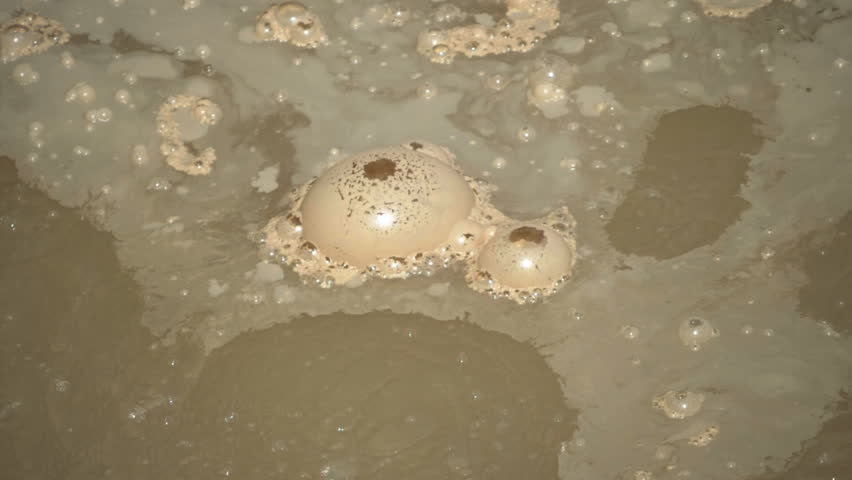 180 fps slow motion close up of bubbles on sulphur caldron in yellowstone national park, usa