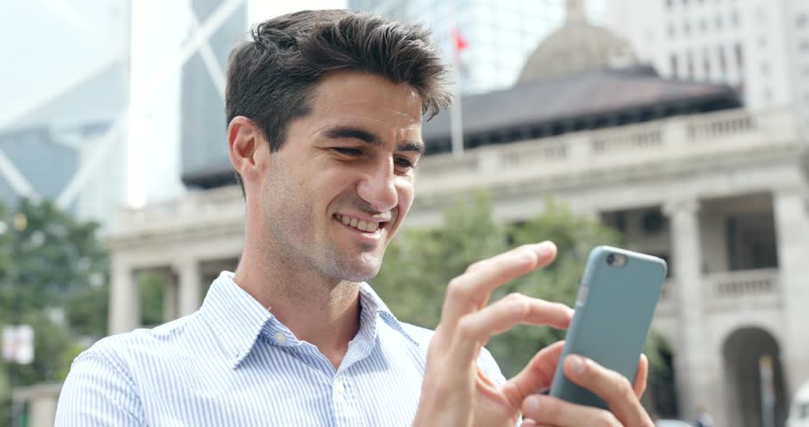 Man use of mobile phone in Hong Kong city