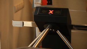 Person passes through the turnstile by electronic card - Powered by Shutterstock - Get 15% off with code: PIKWIZARD15