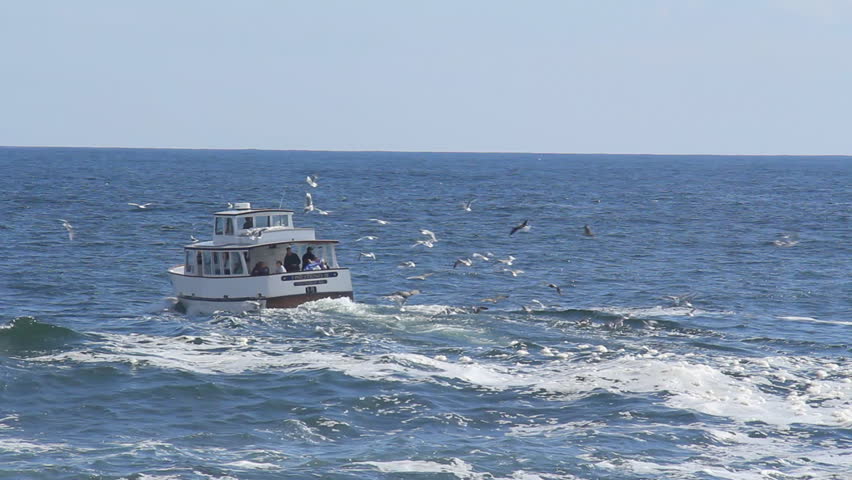 MAINE - CIRCA OCTOBER 2011: A fishing boat carrying tourists passes through a