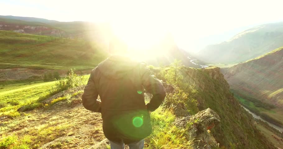 Hiker standing on top of a mountain