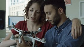 Diverse Man and Woman Engineers Holding a Robot Portrait. - Powered by Shutterstock - Get 15% off with code: PIKWIZARD15