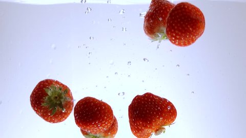 Strawberries in crystal clear water