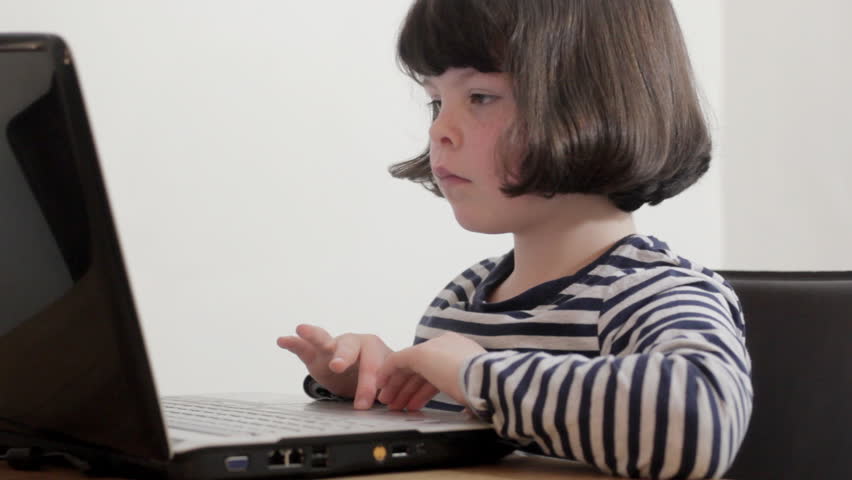 Young girl using laptop, 1 of 5