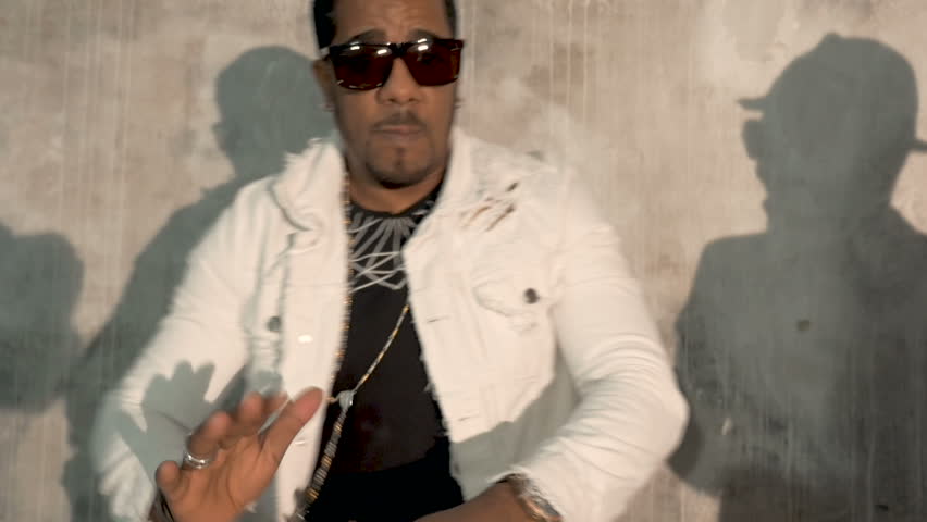 African male musician playing drums. Very emotional. Close-up.