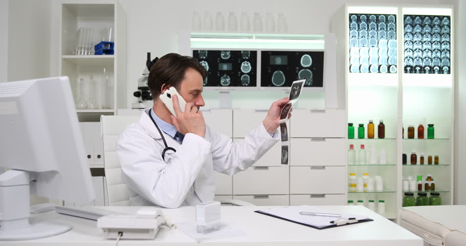 Medical Doctor Man Negative Response Talking Phone Examine Abdominal Ultrasound | Shutterstock HD Video #32903950