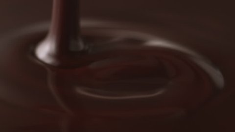 Pouring melted chocolate. Shot with high speed camera, phantom flex 4K. Slow Motion.
