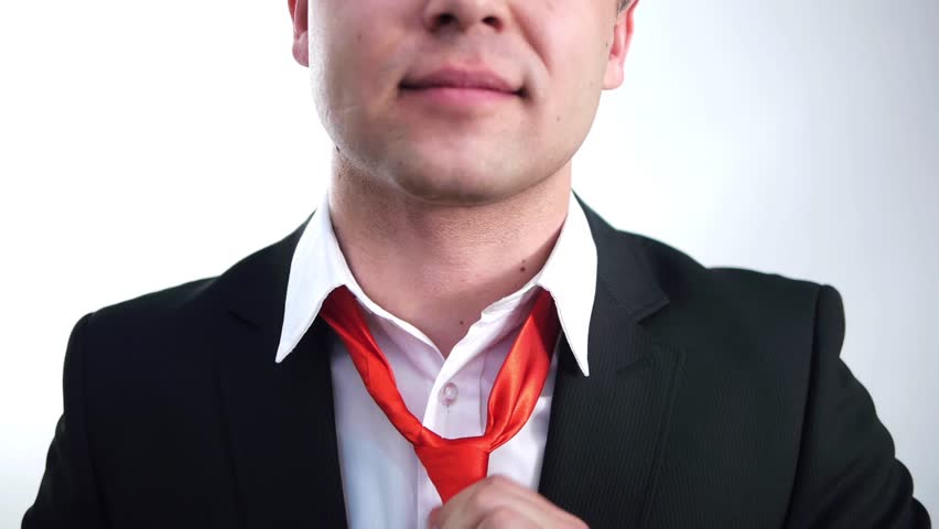 businessman sets his red tie