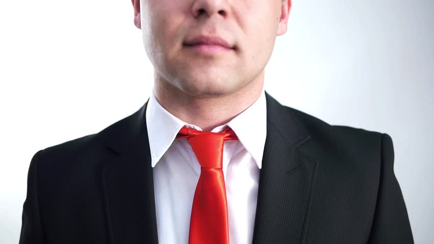 businessman sets his red tie