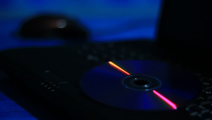 Laptop with dvd, keyboard and mouse.