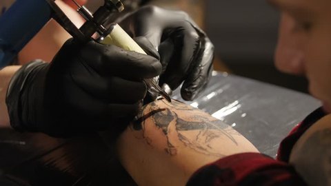 Shot of tattoo artist in creation