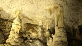 Beautiful natural underground space wall and ceiling decorations slow tilt   1920X1080 HD footage - White stalactites inside cave 1080p FullHD tilting video