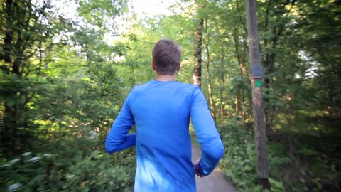 Man running through the forest Stock Video