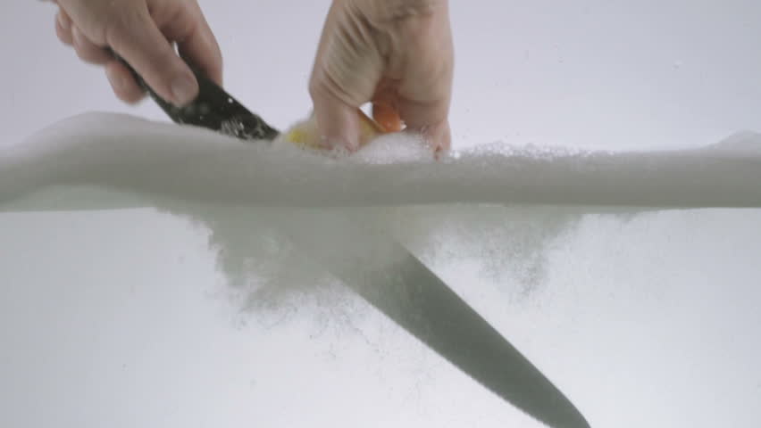 Slow Motion Shot Of Hands Washing A Chefs Knife Using Washing Detergent And