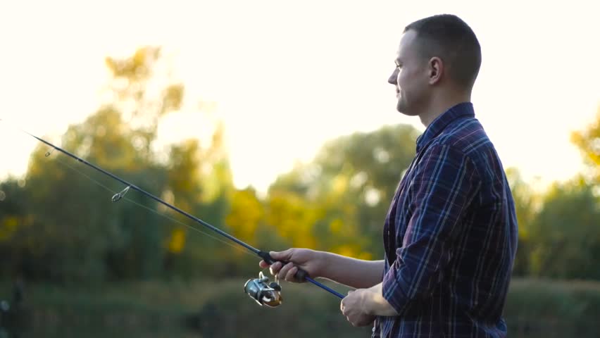 Man fishing with spinning rod