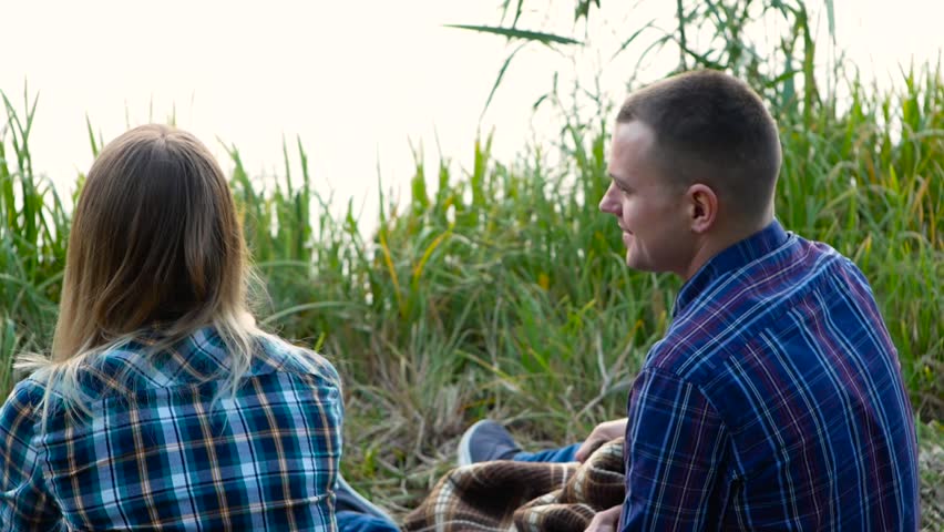 Boyfriend covering his love with plaid