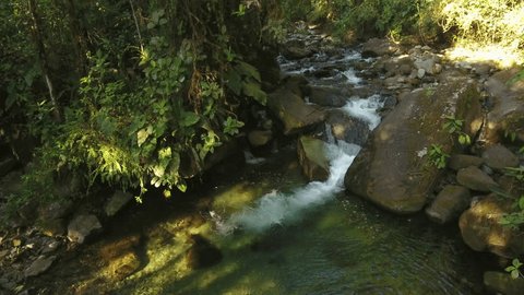 Flying over a waterfall in pristine montane rainforest at the Los Cedros Biological Reserve in western Ecuador