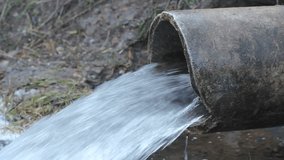 Industrial water pipe into river - Powered by Shutterstock - Get 15% off with code: PIKWIZARD15