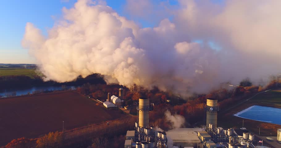 Massive cloud of smokestack emissions overshadowing rural countryside, aerial view.
 Royalty-Free Stock Footage #32953621