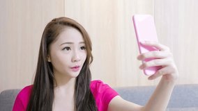 video of woman selfie happpily in living room at home