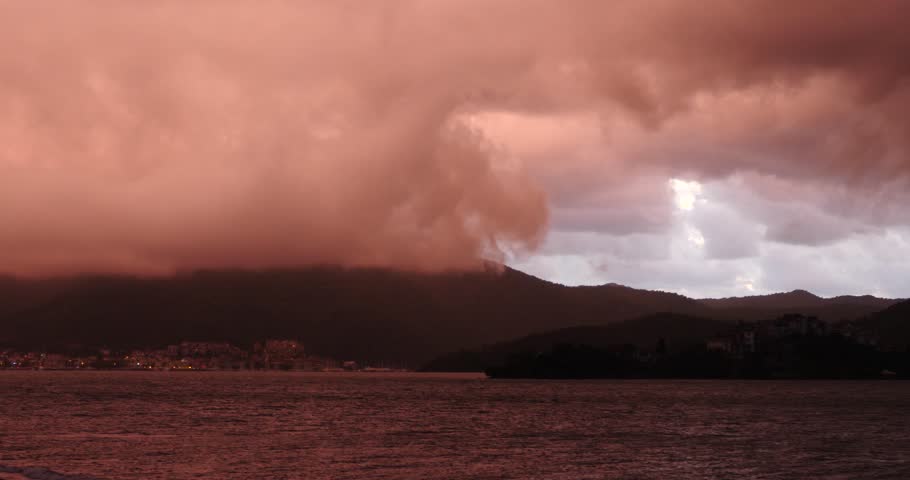 rainy sunset red clouds on island