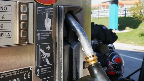Gasoline or petrol station gas fuel pump nozzle. Filling station. Close-up of using a fuel nozzles at a gas station.
