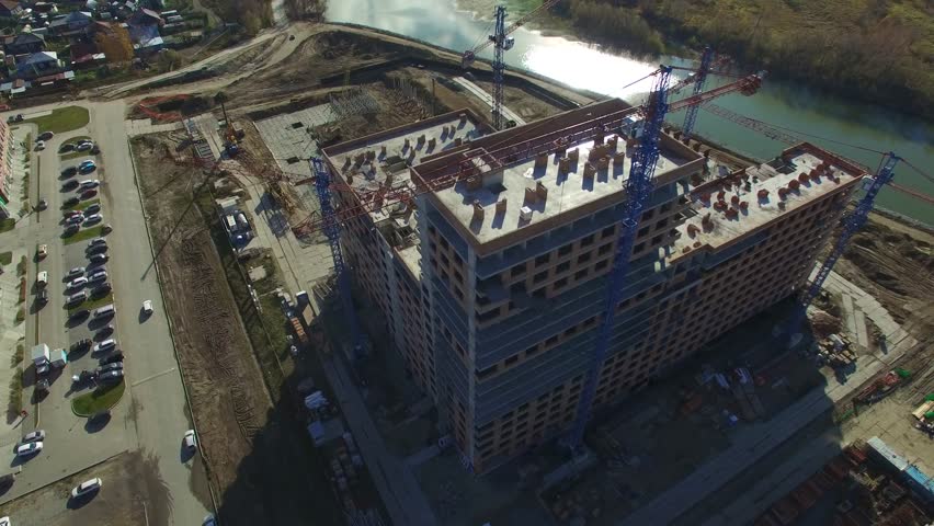 Flight over construction of the housing complex "European Bank", buildings near the river in Novosibirsk city, Russia