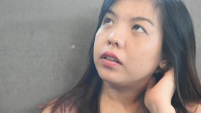 Video Asian beautiful woman serious with smart phone in coffee shop, concept sad moment