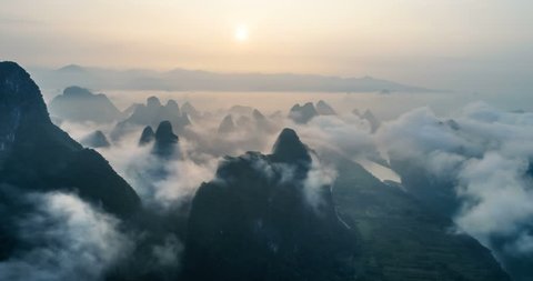 time lapse of aerial view of Karst mountains and beautiful cloudscape at sunrise. Located near The Ancient Town of Xingping, Yangshuo County, Guilin City, Guangxi Province, China.