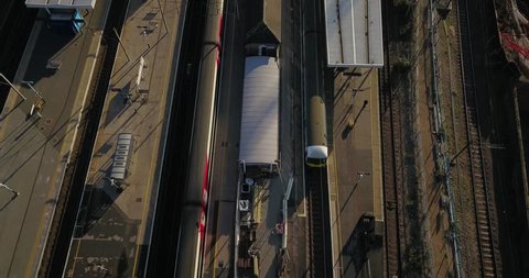 Aerial drone footage of a flight over railway tracks in North London, England.